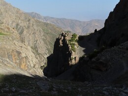         the trail goes down from the shelf and crosses the gulley